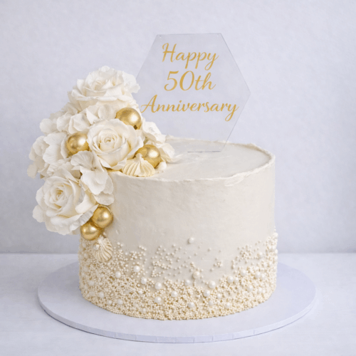 Elegant pearl and floral anniversary cake