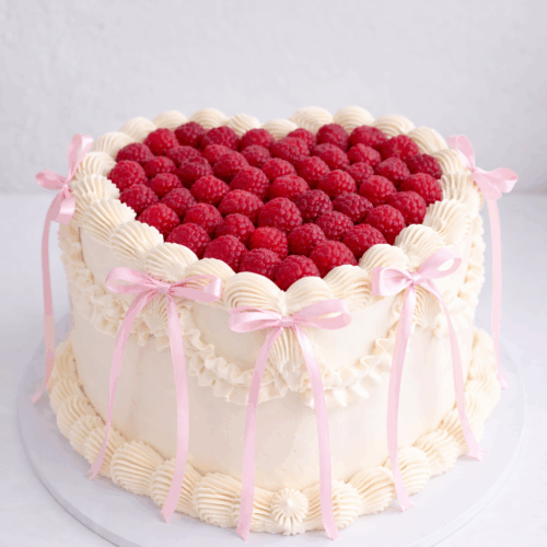 Vintage cake with raspberries and bows